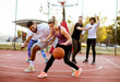 © BGStock72 - Group of multiracial young people   playing basketball outdoors