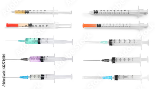 Foto  Set with different syringes on white background. Medical objects