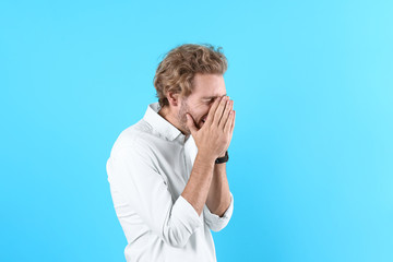 Sticker - Handsome young man laughing on color background