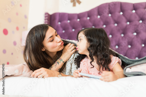 Fotografia, Obraz Young Mom And Girl Expressing Their Love Towards Each Other
