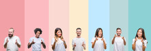 Collage Of Different Ethnics Young People Wearing White T-shirt Over Colorful Isolated Background Pointing Fingers To Camera With Happy And Funny Face. Good Energy And Vibes.