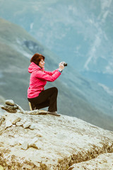 Wall Mural - Tourist taking photo from Dalsnibba viewpoint Norway