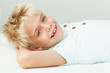 © Samantha McBride - Smiling boy lying down