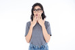 Portrait of amazed Asian young woman. Girl with eyeglasses  isolated on a white background.Woman in shock. Surprising facial emotions