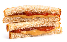 A Classic Peanut Butter And Strawberry Jelly Sandwich On Wheat Bread