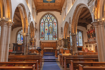 Wall Mural - LONDON, GREAT BRITAIN - SEPTEMBER 20, 2017: The nave of church St. Olave with the stained glass by A. E. Buss (1953).