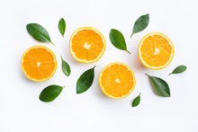 Top View Of Orange Fruits And Leaves Isolated On White Background.