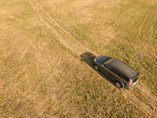 aerial top view of car isolated on summer field texture background f