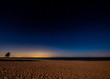 Starscape over Lake Michigan with Chicago lights in the distance