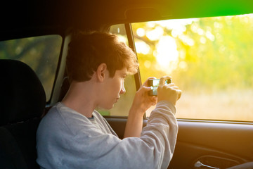 young person doing a photo on a smartphone in national park f