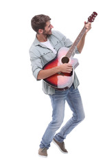 in full growth.young male musician with guitar