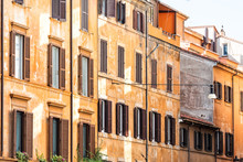 Rome, Italy Street In Historic Center Facade Exterior Windows Wall During Sunny Summer Day, Nobody, Orange Yellow Red Old Colorful Painted Walls