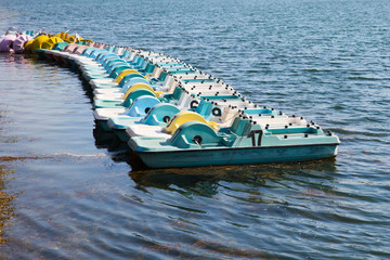 Colorful pedal boats on the lake