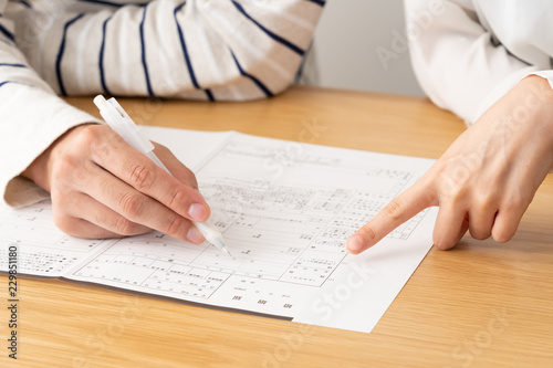 Fotomural young asian couple writing marriage registration