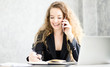 © pic for you - Business woman working at office with laptop and documents on her desk.business concept.business woman is talking on the phone,contacting clients and taking notes.