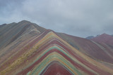 Fototapeta Tęcza - Vinicunca, also called Montaña de Siete Colores, Montaña de Colores or Rainbow Mountain, in a cloudy day, in Perù.