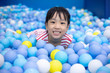 Leinwandbild Motiv Asian Chinese little Girl Playing At Balls Pool