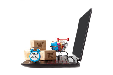 Internet shop / e-commerce sale and delivery concept: basket with boxes and boxes on laptop keyboard and black friday watch on white background