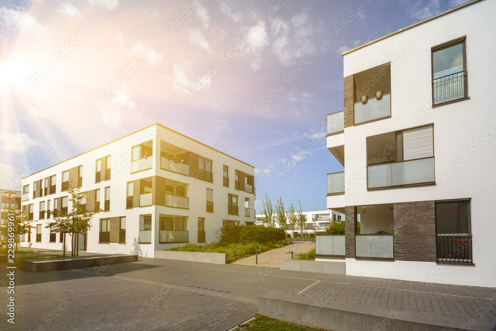 Modern residential area with apartment buildings in a new urban development - obrazy, fototapety, plakaty 