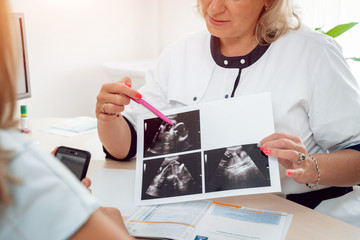 Doctor gynecologist consulting patient. Patient at doctor office. Diagnostic