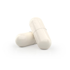 Two capsules supplement on white background. 3d pill isolated.