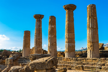 Wall Mural - Remains of Heracles temple - Valle dei Templi located in Agrigento, Sicily. Unesco World Heritage Site.