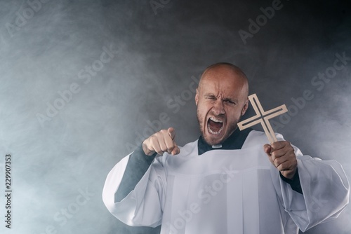 Fotografía Catholic priest exorcist in white surplice and black shirt