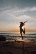 © pha88 - Happy girl at sunset by the sea.Silhouette photo