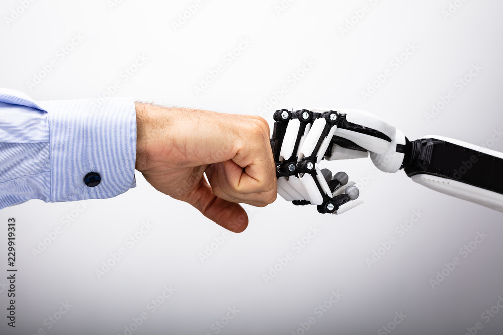 Human Hand And Robot Making Fist Bump - obrazy, fototapety, plakaty 