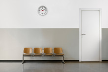 Empty Waiting Room With Chairs, Clock On Wall And Door.