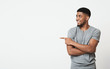 © Prostock-studio - African-american man pointing aside at copy space