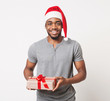 © Prostock-studio - Happy black man holding christmas gift box