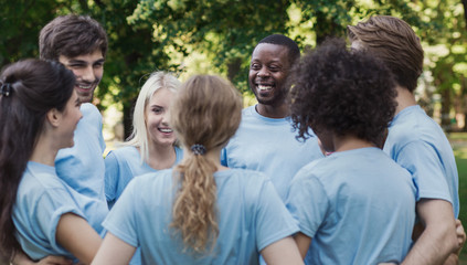 Meeting of young volunteers team in park