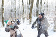 © Marko - Beautiful young couple throwing snowballs at each other