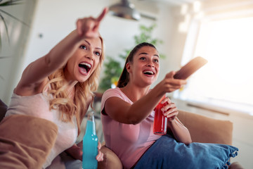 Sticker - Two girls watching tv together