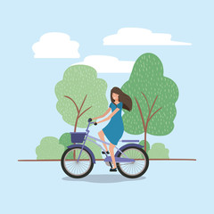 Wall Mural - young woman in bicycle on park