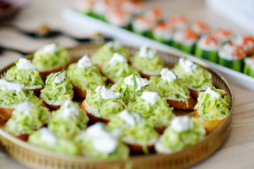 Wall Mural - Delicious zucchini and mint bruschettas served on a party or wedding reception.