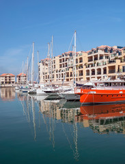 Boats in the port of Gibraltar, with the buildings in the background