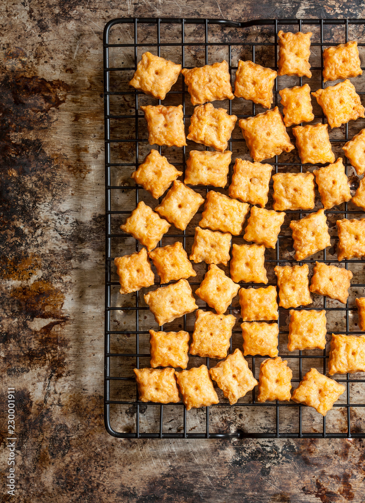 Homemade cheese crackers cooling on rack Stock Photo | Adobe Stock