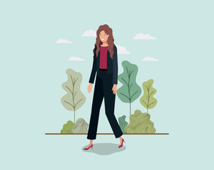 Wall Mural - elegant businesswoman walking in the park