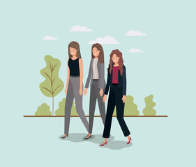 Wall Mural - elegant businesswomen walking in the park