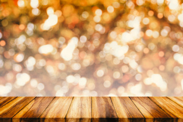 Poster - Empty wood table with bokeh abstract yellow background.