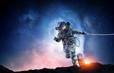 Wall Mural - Spaceman steal planet. Mixed media