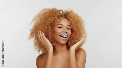 Mixed Race Black Blonde Model With Curly Hair Open Her Smile Hided
