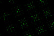© maykal - Drawing on a black wall with a green laser. Abstract drawing