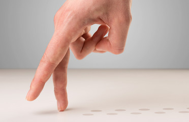 Female fingers walking with dots behind them