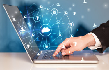 Poster - Hand using laptop with centralized cloud computing system and network security concept
