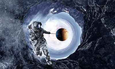 Wall Mural - Spaceman steal planet. Mixed media