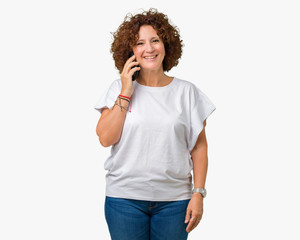 Middle ager senior woman talking on smartphone over isolated background with a happy face standing and smiling with a confident smile showing teeth