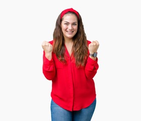 Beautiful plus size young woman over isolated background celebrating surprised and amazed for success with arms raised and open eyes. Winner concept.